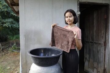 Woman doing laundry in the morning.
