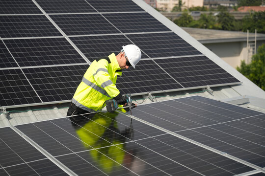 Professional who installs solar energy systems,  procuring equipment, and performing the physical installation of solar panels on roofs. 