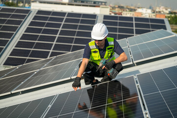 Professional who installs solar energy systems,  procuring equipment, and performing the physical installation of solar panels on roofs.  © FotoArtist