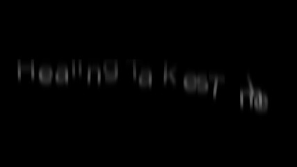 White text "healing takes time" on a black background with a slight blur and soft lighting