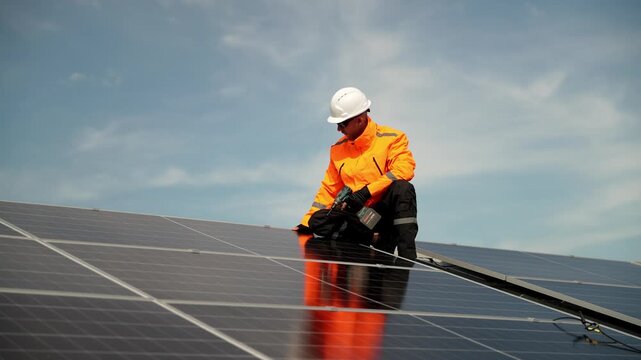 Professional who installs solar energy systems,  procuring equipment, and performing the physical installation of solar panels on roofs. 