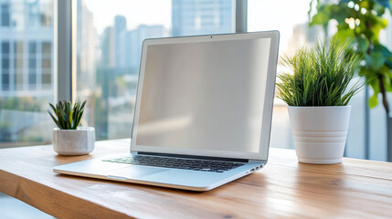 Fototapeta premium Modern laptop on wooden desk by window with potted plants, bright workspace, calm mood