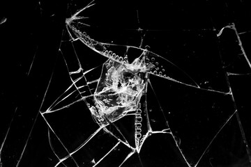cracked glass isolated in black background