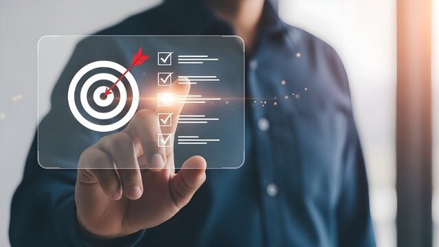 Reaching business goals with technology man interacting with a digital interface displaying a target - Powered by Adobe