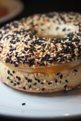Freshly baked bagel with sesame and poppy seeds