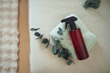 Cleaning supplies on a soft surface with greenery © Towfiqu Barbhuiya 