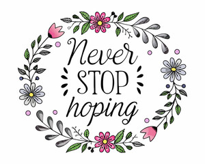 Never stop hoping inspirational quote surrounded by floral wreath