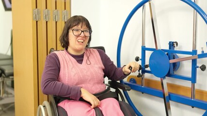 Woman with physical disability smiling during physical therapy