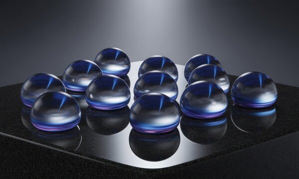 Clear, translucent orbs arranged on a dark surface - Powered by Adobe