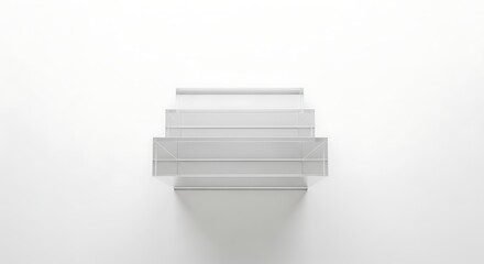 Front view of a modern, empty, multi-tiered shelf unit casting a soft shadow on a white wall.