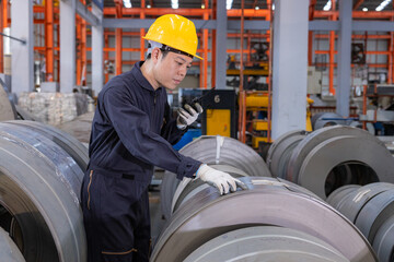 The factory engineer controls the machinery used to produce zinc sheets and uses radio for communication.
