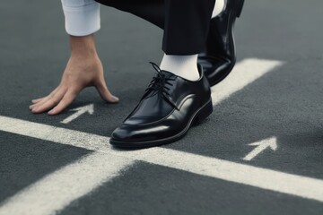 personal vision road concept. A man in dress shoes poised at a crosswalk line.