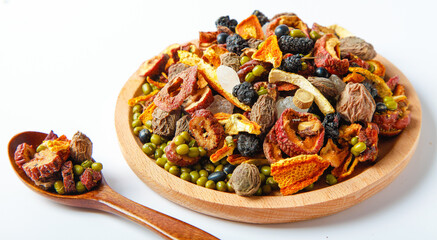 Ancient Chinese Herbal Soup Mix with Dried Plum Chenpi and Beans in Wooden Bowl - Traditional Homemade Health Recipe