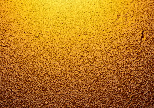 Abstract textured background with a warm golden gradient and intricate repeating geometric patterns creating a sense of depth and luxury