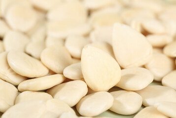 Peeled Sliced Sweet Southern Almonds - Healthy Natural Nuts Background