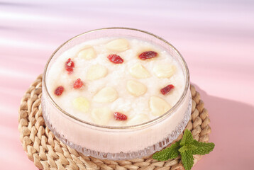 Southern Sweet Almond Pudding with Sliced Almonds and Cranberries - Traditional Dessert with Mint Garnish
