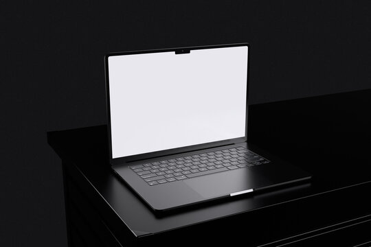 High quality laptop on black table with black background for mockup template