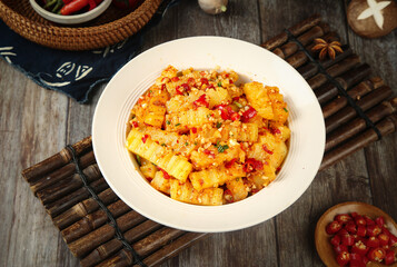 Spiced Potato Wolfsbane Recipe with Red Peppers and Herbs on Rustic Wooden Background
