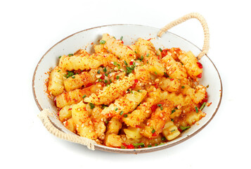 Spicy Roasted Potato Cubes with Herbs and Paprika in Rustic Serving Dish