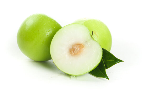 Fresh Taiwan Jujube Fruits Cut in Half on White Background - Traditional Asian Chinese Date