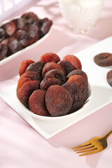 Xinjiang Candied Dried Apricot and Mixed Fruit Gallery in White Bowls on Pink Background