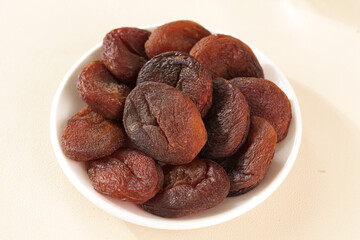 Dried Apricots from Xinjiang China - Traditional Candied Fruit Production in White Bowl