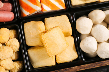 Hotpot ingredients variety tray with tofu balls beef and other Asian delicacies for traditional dining