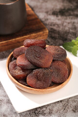 Xinjiang Dried Candied Apricots in Wooden Bowl - Traditional Chinese Fruit Snack Food Photography