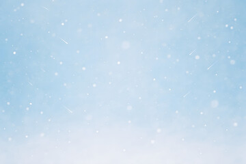 Fototapeta premium Gentle white snowflakes drift across a soft blue sky, creating a peaceful and clean winter background perfect for seasonal designs..