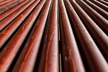 Stack of metal pipes with beveled ends