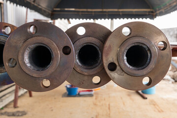 Close-up of welded metal pipe flanges