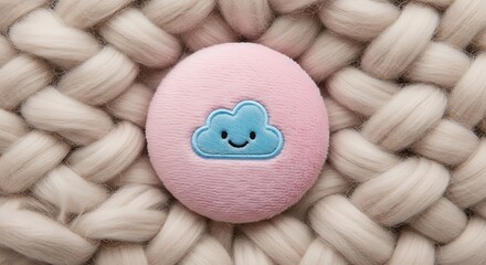 Pink easter egg with smiling cloud embroidery on chunky knit blanket background