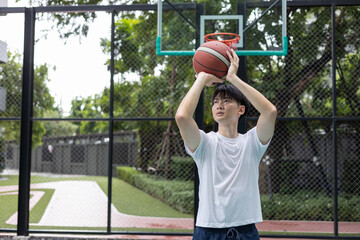 Basketball Player Shooting on Outdoor Court