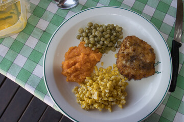 Healthy campers' meal of fresh corn, fresh pumpkin,tinned peas and frozen chicken breast, all prepared on an open fire