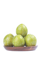 Fresh Chilean Dinosaur Egg Plums on Wooden Plate Studio Shot