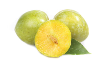 Fresh Green Plums with Yellow Flesh Cut in Half Isolated on White Studio Background