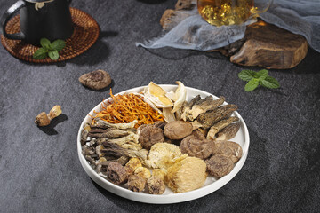 Traditional Chinese Medicinal Mushrooms and Herbal Ingredients Collection in White Bowl