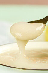 Creamy White Paste Dripping from Spoon - Cooking Ingredient