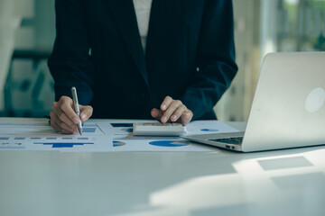 business professional analyzing financial documents at desk