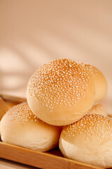 Fresh Sesame Seed Hamburger Buns on Wooden Board - Commercial Food Production