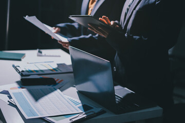 Two business people analyzing the data