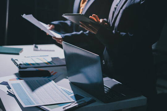 Two business people analyzing the data