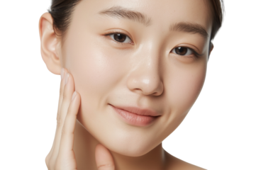 Young asian woman with radiant, healthy skin touching her cheek