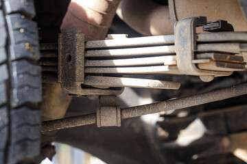 The suspension of a four-wheel drive pickup truck that has been used for rough use