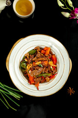 Chinese Roasted Beef with Green and Yellow Peppers Stir-Fry Dish