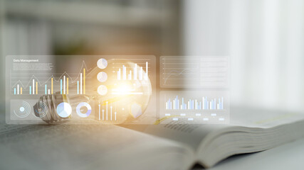 This image showcases modern data management through digital displays of statistics and graphs, combined with an open book, symbolizing knowledge and growth. Gantry
