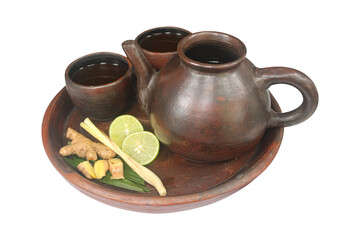 Traditional Indonesian Herbal Drink (Jamu) Served in Terracotta Set