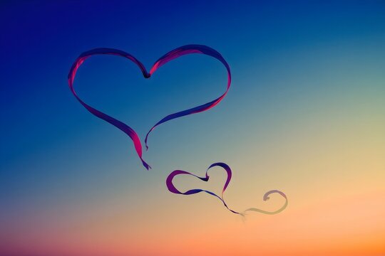 Dancing Ribbons - Heart Shapes Against Sunset Sky