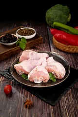 Raw Chicken Legs with Fresh Vegetables and Spices for Meal Prep