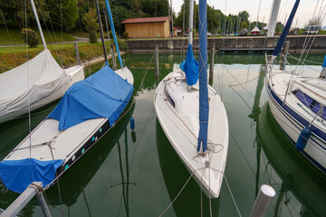 Waiting for the wind to blow on Lake constance morning as sailboats rest in the marina anticipating a day of sailing